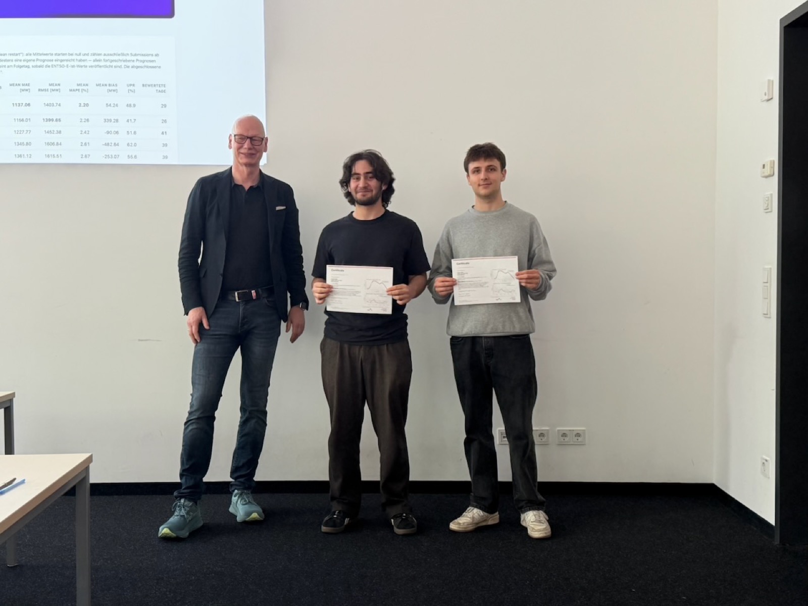 Two students receiving their certificates